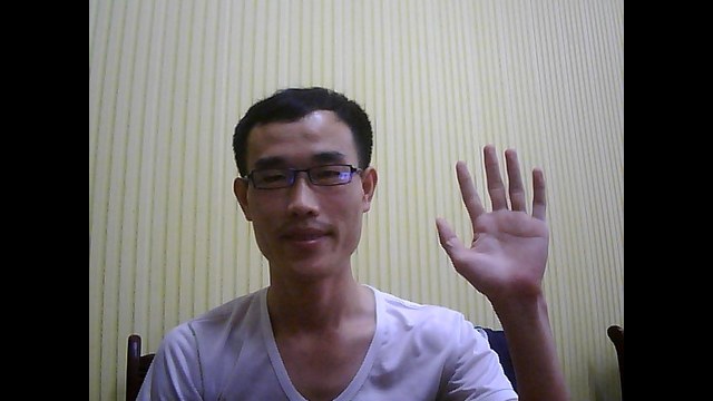 Rami North Korean IT worker waving at camera