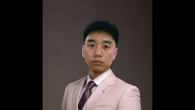 Taku Yamamoto aka Hiroto Iwaki North Korean IT worker pink suit headshot